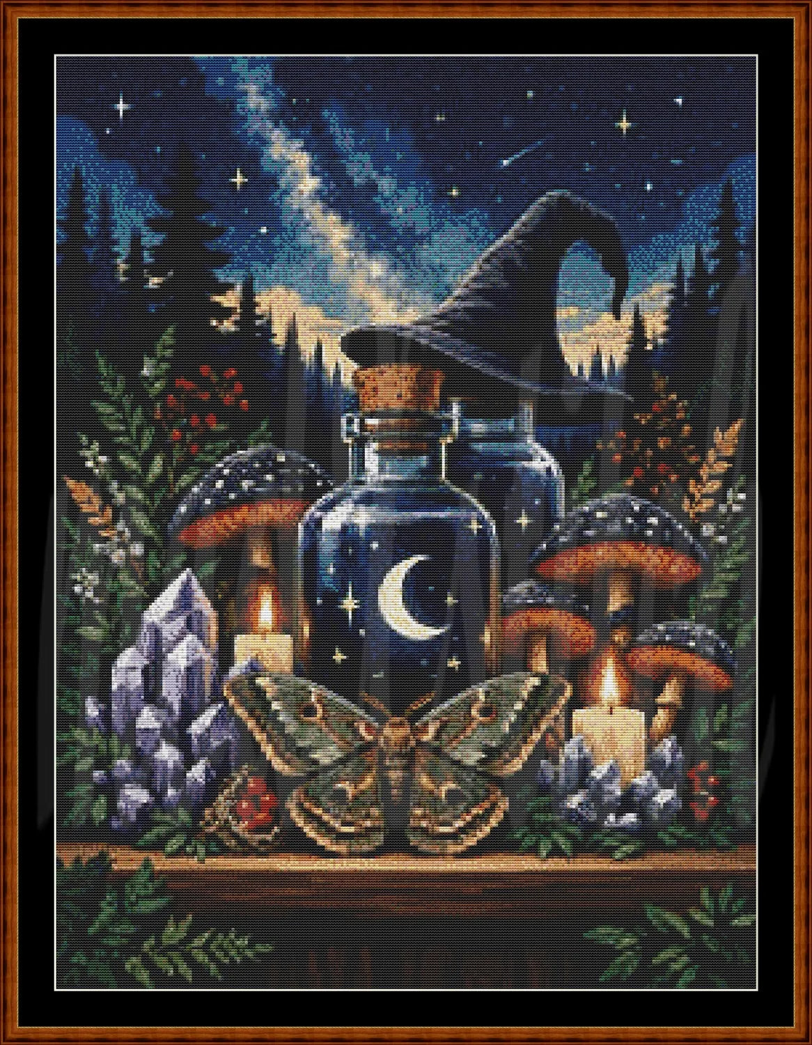 A framed needlepoint or cross-stitch style artwork depicting a witch's potion bottle with a crescent moon and stars, surrounded by mushrooms, candles, a crystal cluster, a large moth, and a dark forest under a starry night sky.