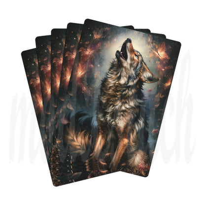 A fan of illustrated cards showing a dramatic wolf howling in a dark forest with glowing leaves and warm light effects, photographed on a white background.