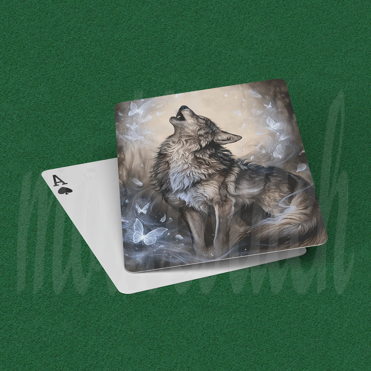 An Ace of Spades playing card with a detailed illustration of a howling wolf surrounded by butterflies, displayed on a green felt surface.
