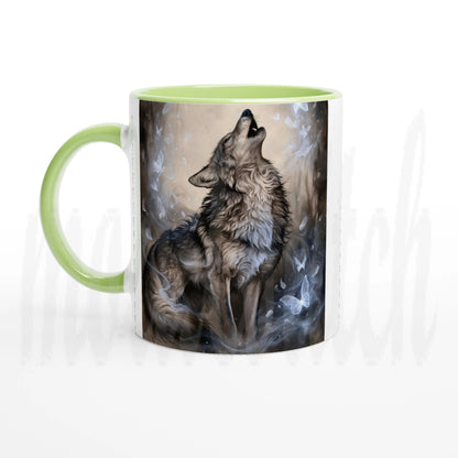 A ceramic mug with a light green handle and interior, featuring a printed graphic of a howling wolf in gray, brown, and white tones on the front.
